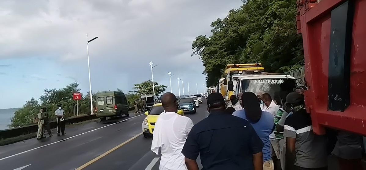 Truckers Assemble Under Canefield Cliff