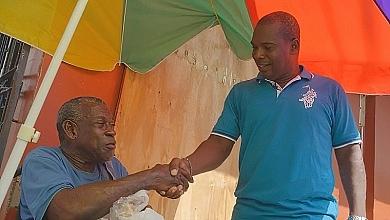 Glenroy Cuffy Shaking Hands With Man