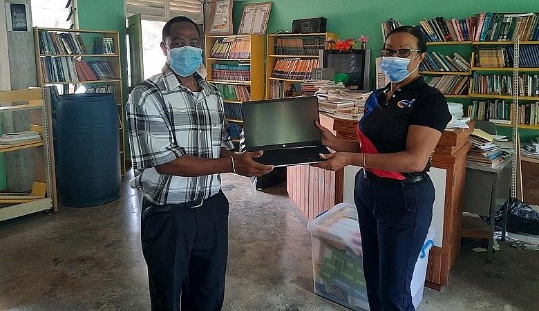 Harris Paints Sales Manager with Technical Teacher at Pierre Charles Secondary School