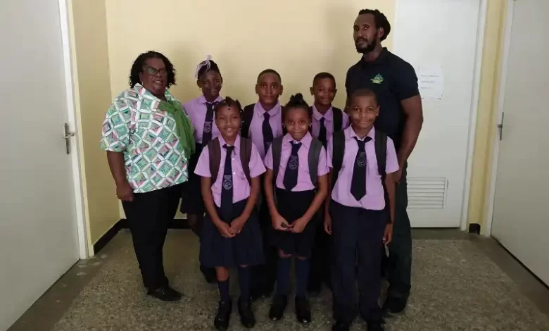 Mr. Kyle Francis with Newtown Primary School Students