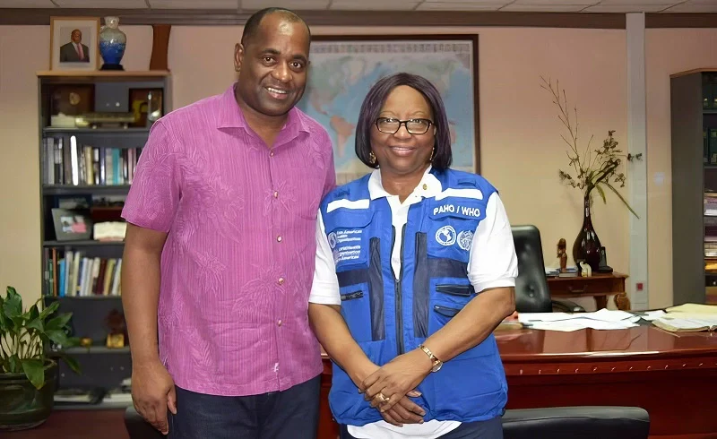 Hon. Roosevelt Skerrit with Dr. Carissa F. Etienne